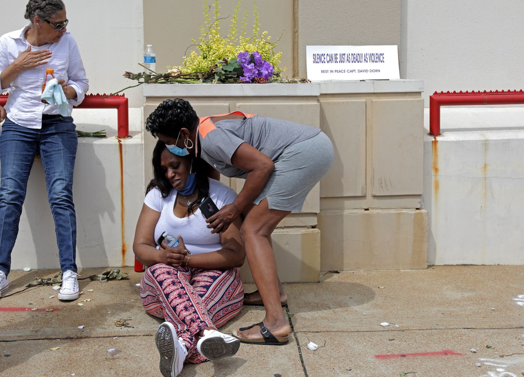 Loved ones remember David Dorn outside Lee's Pawn